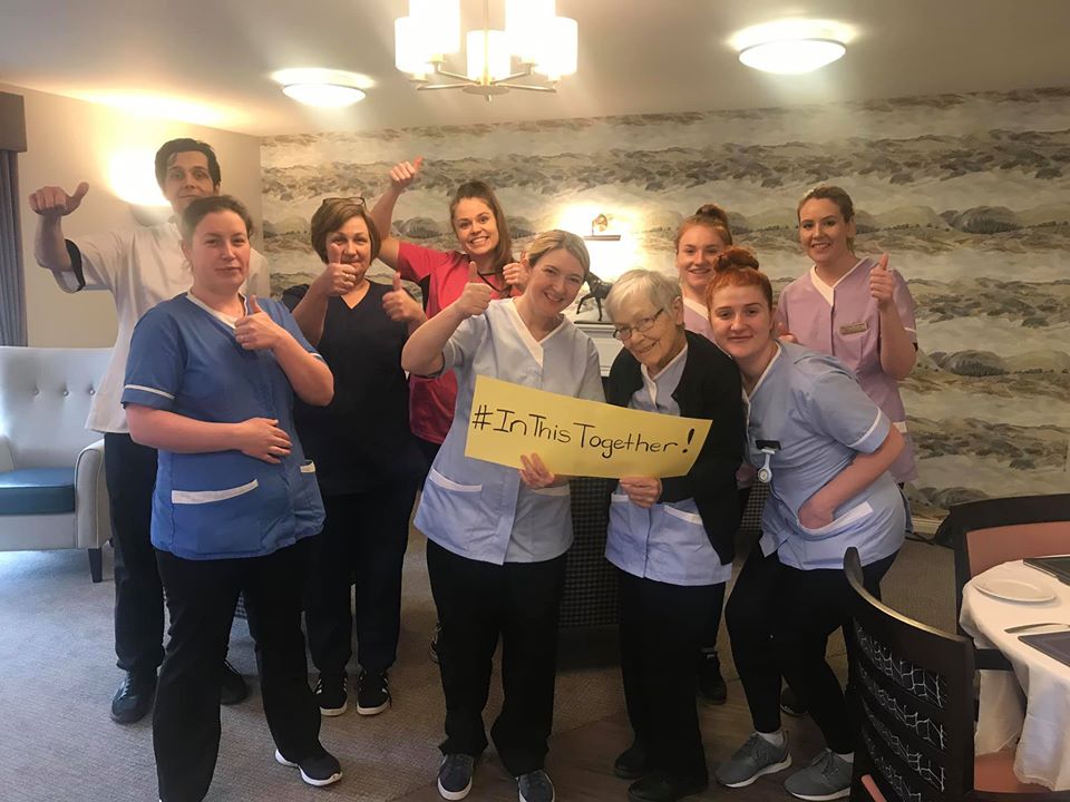 Resident & Staff Doing a Thumbs Up