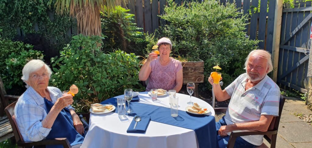 Residents Enjoying Cocktails in The Garden